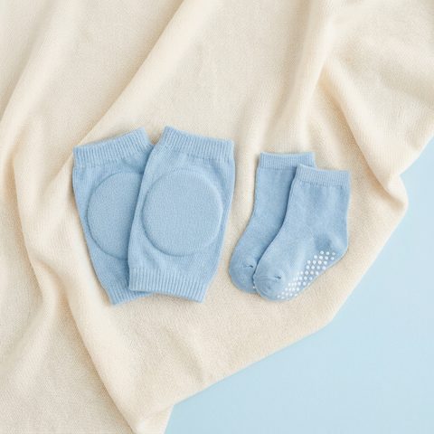Blue crawling knee pads and grip socks